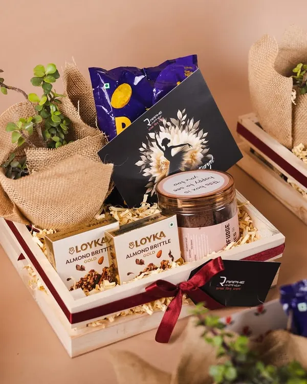 This Women's Day hamper for Raphe features a beautiful pinewood tray and a live succulent plant. It's a perfect example of a sustainable and meaningful corporate gift.