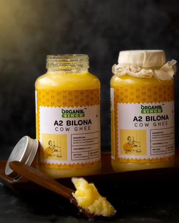 The rich, granular texture of A2 Bilona Cow Ghee is the focus of this dark and moody shot. I used dramatic lighting to create a sense of tradition and purity, highlighting the golden color of the ghee.