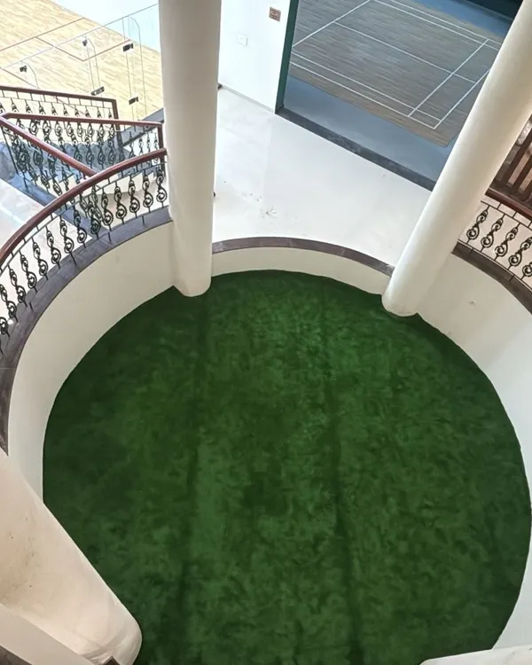 This project showcases a unique indoor application of artificial grass. I installed a circular turf area in a building's atrium, adding an unexpected and refreshing pop of green to the common space.