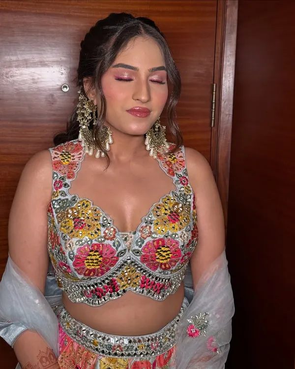 A gorgeous look for a Mehendi or Sangeet. I used a pop of bright pink on her eyelids to match the colorful embroidery on her lehenga, creating a fun and festive vibe.