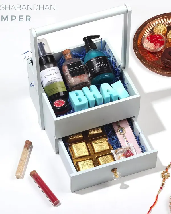 My Rakshabandhan Hamper, designed to celebrate the bond between siblings. This beautiful two-tiered gift box includes a selection of my organic handmade skincare, along with traditional sweets and a rakhi.