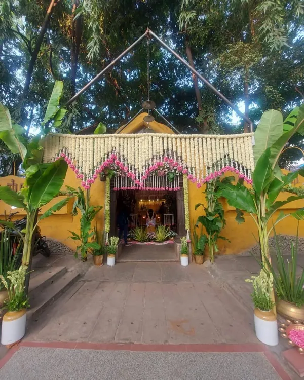 The entrance to a Seemantham that is a true ode to tradition. We used banana trees, brass pots, and a beautiful canopy of tuberose and pink carnations to welcome guests into a sacred space.