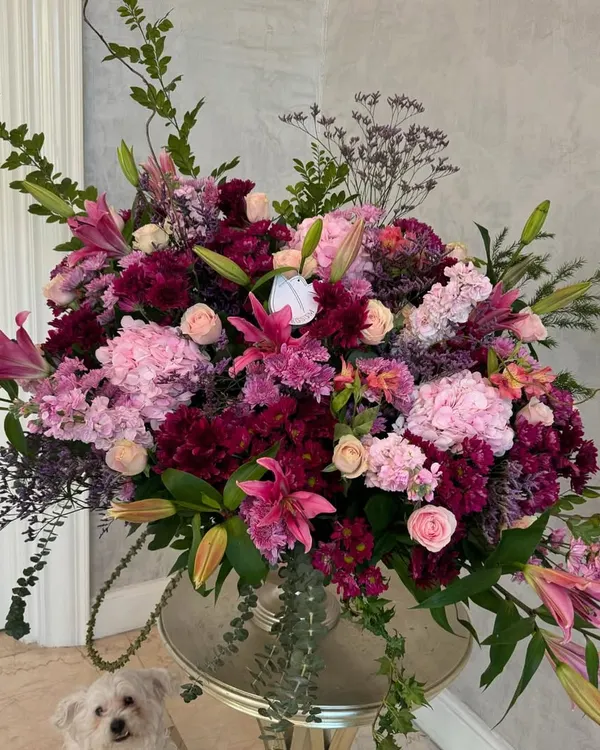 This is perhaps the largest flower arrangement possible to deliver, a true testament to my love for abundance. Our 'Pink Soda Fountain' is a magnificent cascade of pink hydrangeas, lilies, and roses, designed to make the grandest of statements.