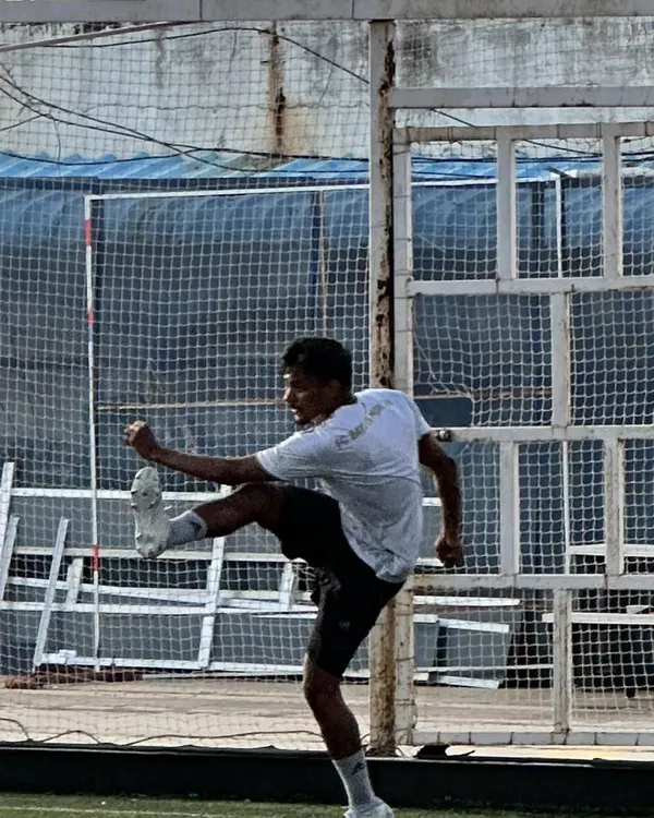 A shot of me in action during our community football tournament. It's all about bringing people together, staying active, and enjoying the sport.