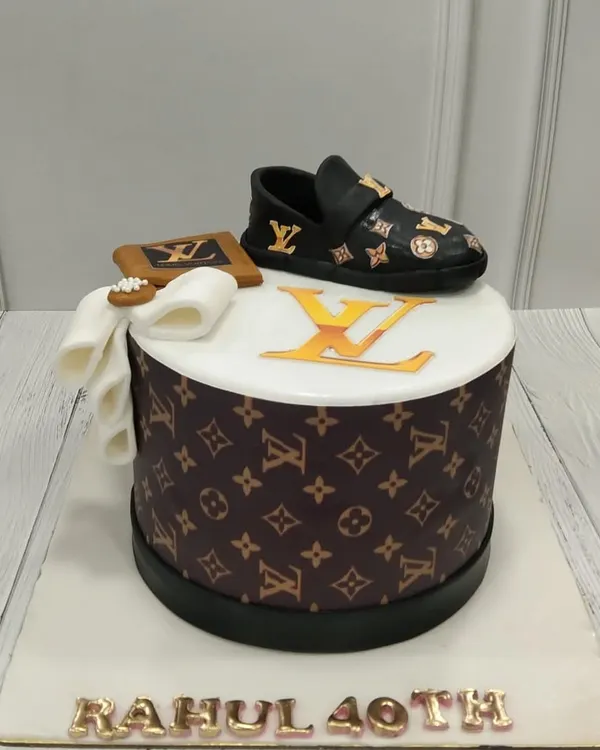 For the luxury lover, we designed this cake inspired by Louis Vuitton. It features the iconic monogram pattern, topped with an edible, hand-sculpted shoe and wallet.
