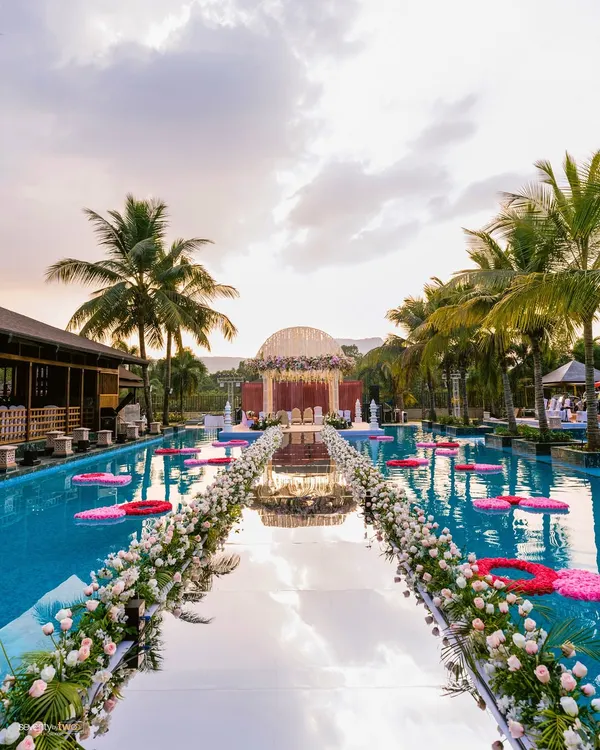 Imagine walking on water to meet your forever. For Aishwarya and Zankheel's wedding in Karjat, we captured this cinematic varmala ceremony on a mirrored aisle built over the resort pool, creating a moment that felt like a scene from a dream.