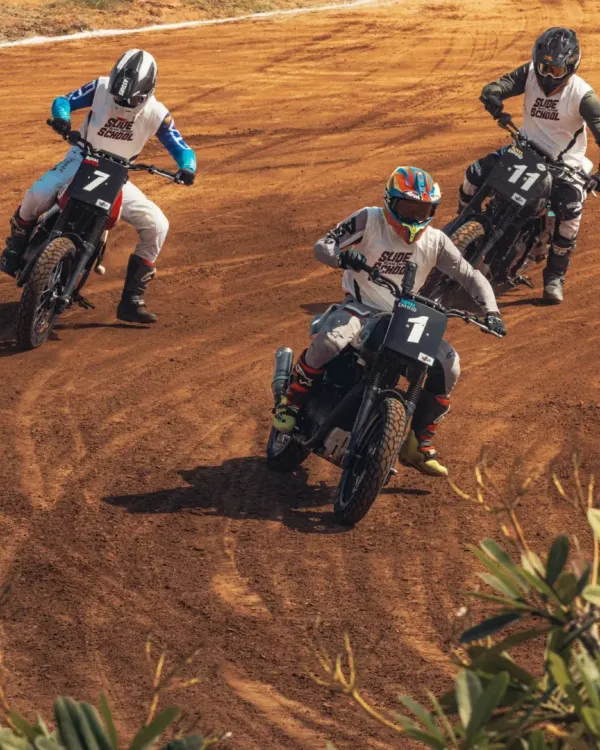Leading the pack at the Royal Enfield Slide School Cup. Flat track racing requires a unique skill set, managing traction and sliding the bike through corners on a dirt oval.