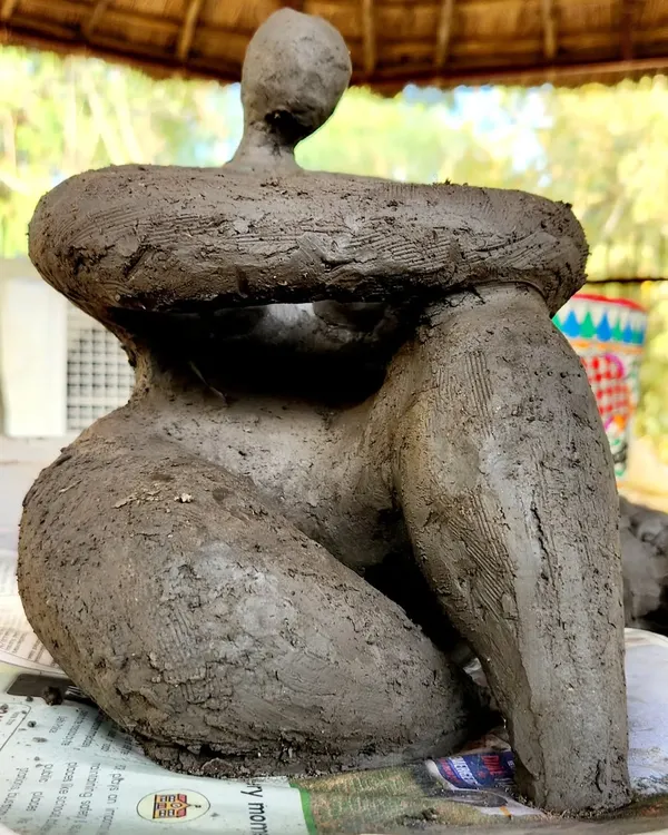 A powerful, expressive sculpture created using hand-building techniques. This piece, titled "Being Woman," shows the artistic possibilities that clay offers beyond functional pottery.