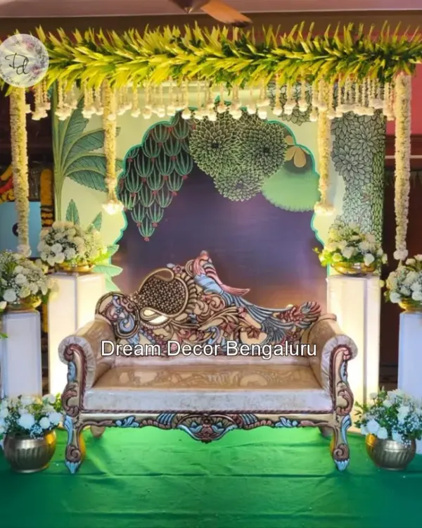 A trending Pichwai decor I did for an engagement. The peacock-themed sofa and the artistic backdrop with lush greenery create a royal and traditional ambiance.