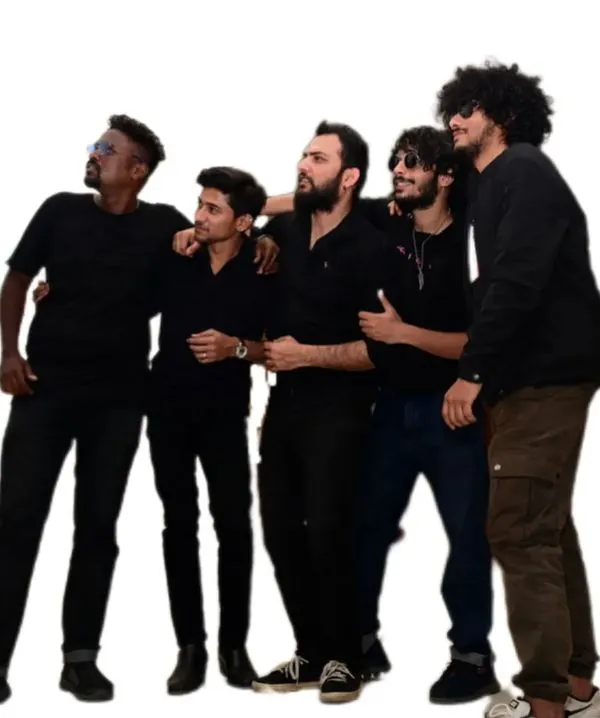 The full band sharing a light moment. We have a lot of fun on and off the stage, and that chemistry is what makes our music click.