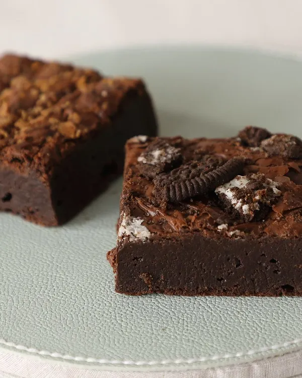 Fudgy, gooey, and irresistible. Here are two of my most popular brownie varieties: the Creamy Oreo Brownie and the Nutella Hazelnut Brownie.