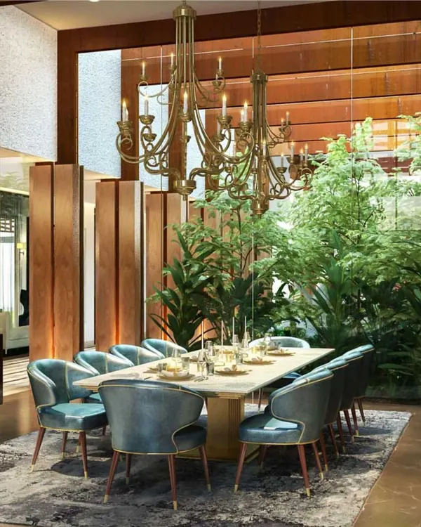 This is what home means to us. A space where life unfolds, where the boundaries between inside and out dissolve, and where every detail, from the grand chandelier to the lush courtyard view, comes together to create a seamless experience. We designed this dining area not just for meals, but for moments of connection with nature and family.