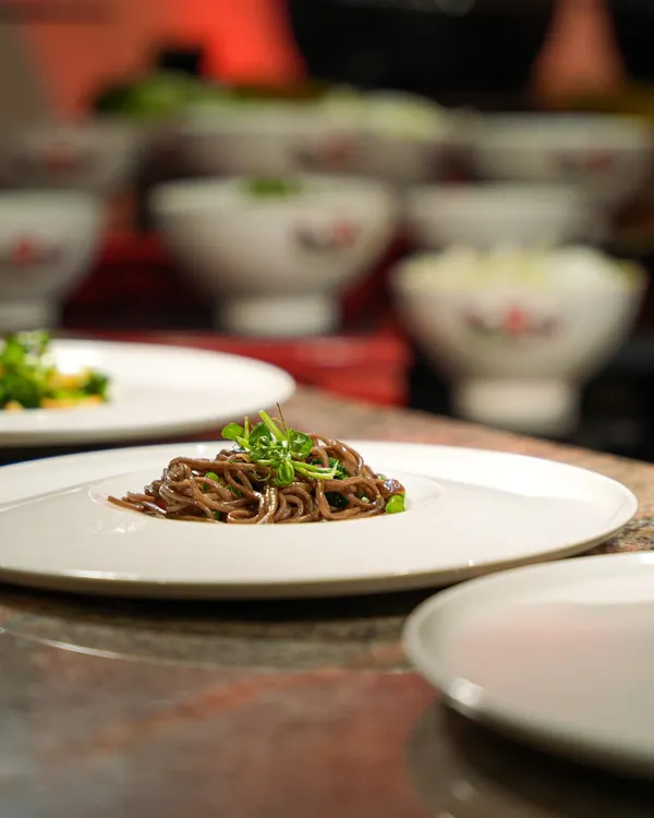 A beautifully plated dish of soba noodles, prepared for a corporate luncheon. This light and healthy option is both flavourful and elegant.
