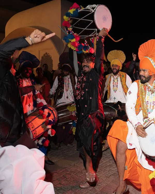 The heart of the party at a 70th birthday celebration in Chandigarh. This was a weekend of unapologetic Punjabi splendor, and this image captures the energy of the Jaago night with dhol players and Bhangra dancers in traditional attire.