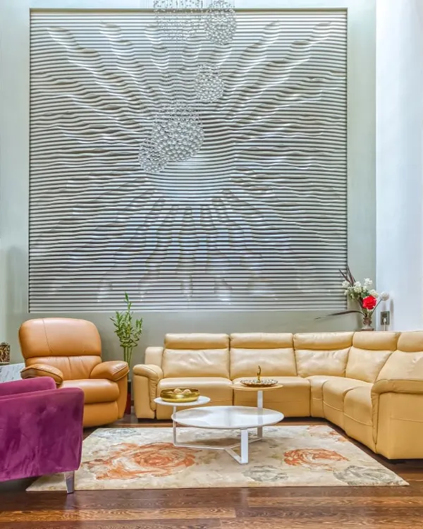 For "A Home by the Park," we created this double-height living room featuring a massive, custom-designed art installation. The piece becomes the focal point, reflecting light and adding texture to the space.