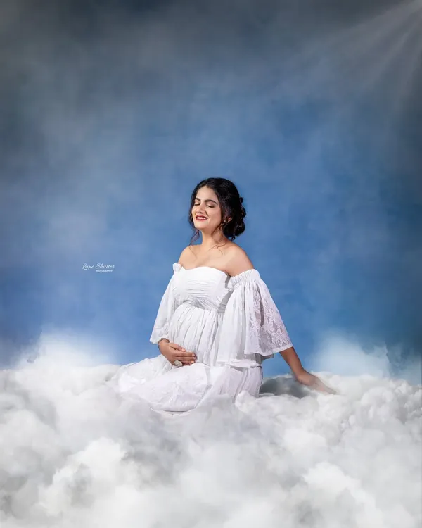 This is a vision I held for so long, brought to life. We created this dreamy, sky-inspired maternity portrait indoors using a hand-painted canvas backdrop and soft, cloud-like textures to capture the feeling of being on cloud nine.
