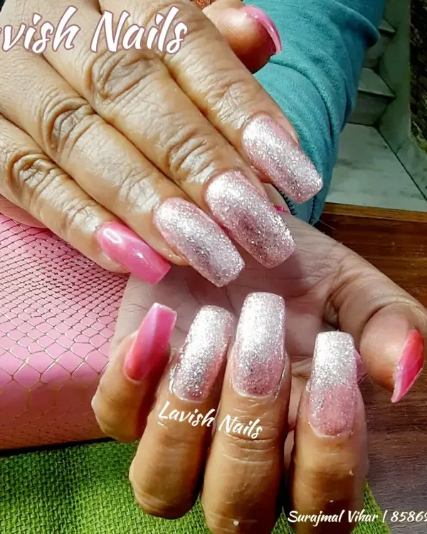 Extra-long square nails showcasing a dramatic pink and silver glitter ombré effect, perfect for a high-glamour bridal or reception look.