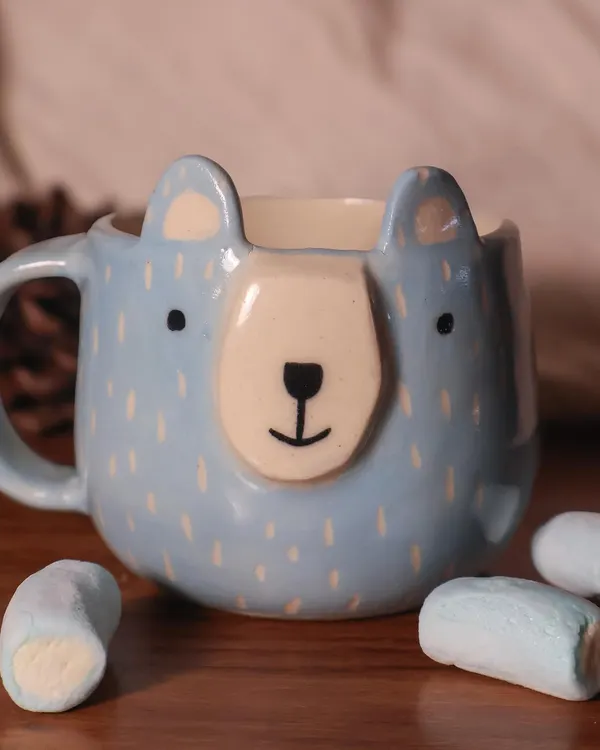 This bear-faced mug is perfect for a cozy cup of hot chocolate. The details are hand-built and painted to give each one a unique, friendly expression.