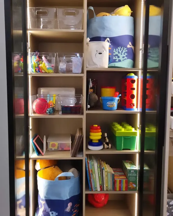 The more visible and colorful a kid's setup is, the more they'll use it. We kept easy-to-use toys on lower shelves for independent play and toys requiring supervision up higher.