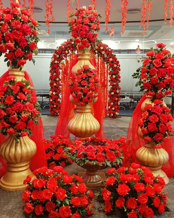 I believe every corporate space holds the potential for magic. Here, I transformed a standard office area into a breathtaking scene of romance and celebration using hundreds of red roses and dramatic golden urns, perfect for an anniversary or Valentine's Day event.
