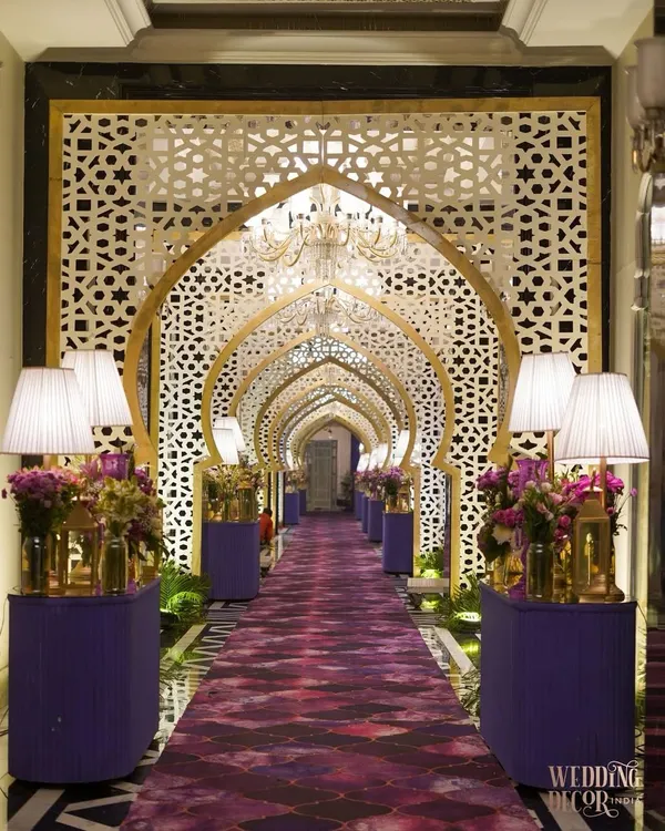 We believe every entrance should be a gateway to an unforgettable experience. For this Sufi-inspired evening, we designed a grand arched walkway, blending intricate jaali work with a regal purple carpet and soft, ambient lighting to welcome guests into a world of enchantment.