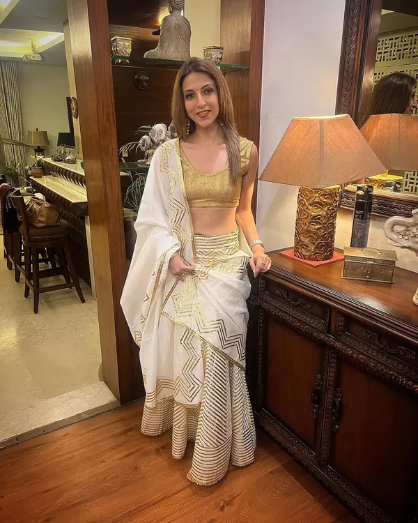 I love dressing up for the festive season. This white and gold ruffled saree is one of my favourites for a modern yet traditional look.