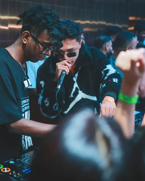 Sharing the mic with an artist during a packed club night. My sets are interactive, bringing the hype and working with performers to create a live, dynamic experience.