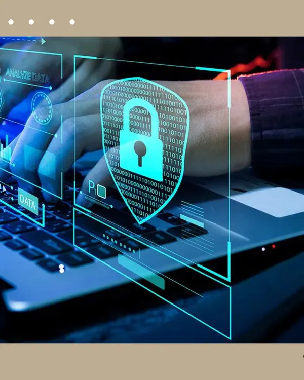 A visual of hands on a laptop with a digital security shield overlay. This represents the robust, cyber-secure foundation of KNX systems, ensuring your smart home network is protected from external threats.