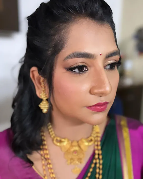 This client wanted a very simple, "girl next door" look for her engagement. I gave her a subtle "no makeup" makeup style with simple beach waves, exactly as she requested.