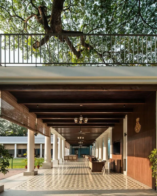 The new colonnade at the Bangalore Club provides a sweeping, sheltered view of the main lawn. I used a timber-clad roof and heritage-patterned tiles to ensure the addition felt like a natural extension of the club's historic architecture.