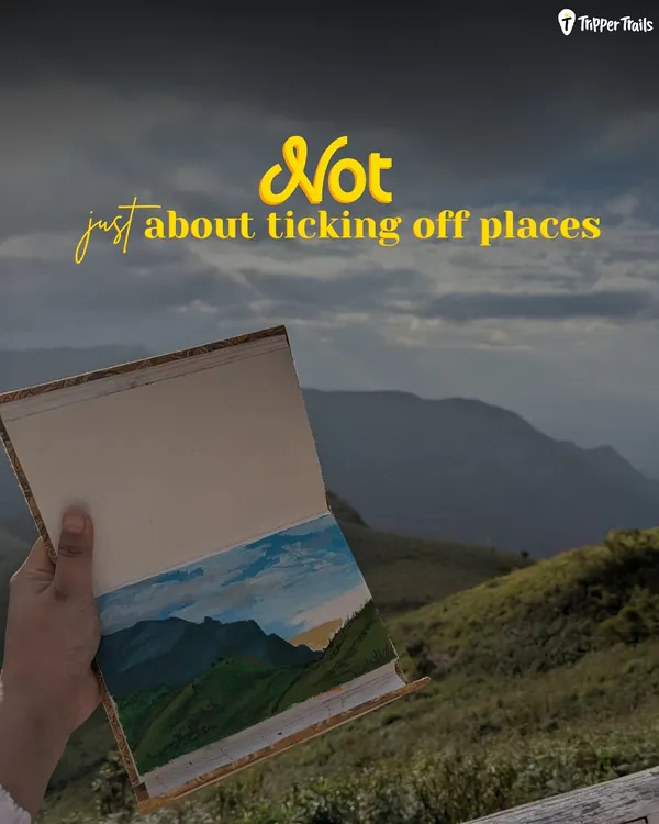 This isn't about ticking off places; it's about the experience. This image from our off-beat Kodai trip shows a hand holding a painted journal against the hills, capturing the soul of the journey.