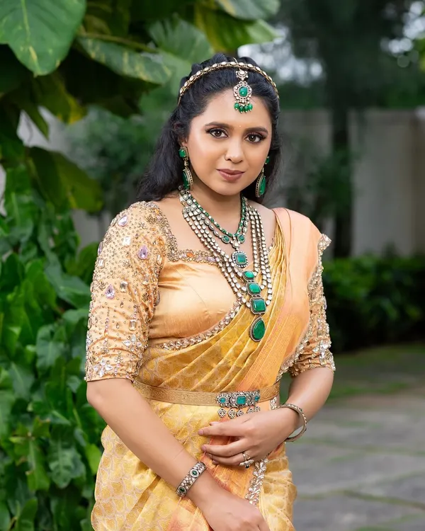 This look from my 'Athiloka Sundari' series features me in a pure Kanchi saree. I paired it with a blouse adorned with intricate embroidery and semi-precious stone embellishments, creating a regal outfit designed to make any bride feel like a princess.