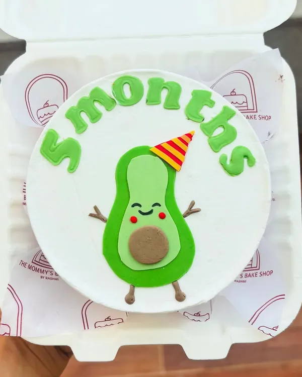 The cutest avocado cake for a 5-month celebration. This little guy is made from fondant and is perfect for marking monthly milestones.
