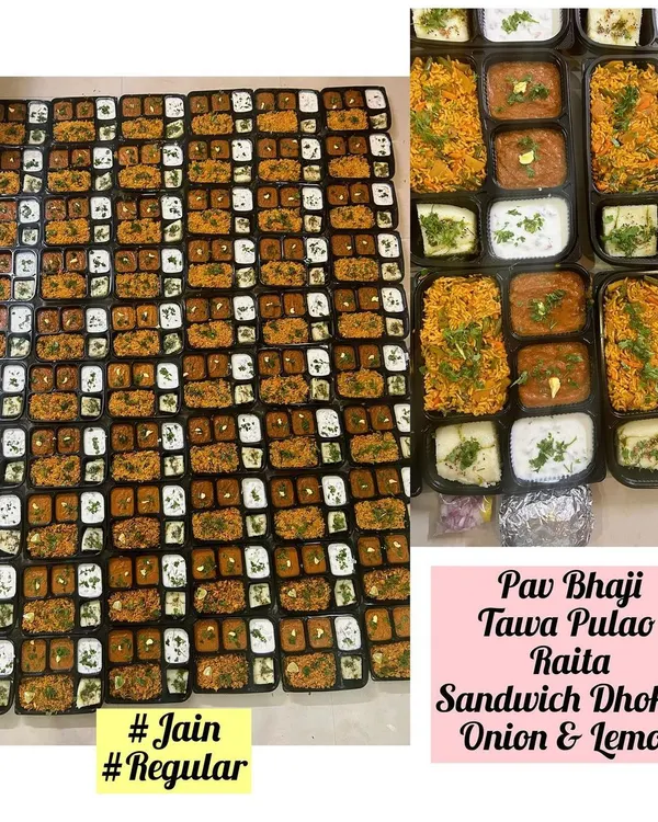 A large order of individually packed meals, featuring both Jain and regular options. Each box contained Pav Bhaji, Tawa Pulao, Raita, and Sandwich Dhokla for a convenient and complete meal.
