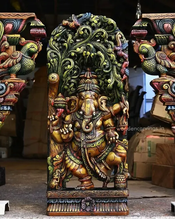 This vibrant, multicolored dancing Ganesha panel, flanked by a pair of Annapakshi wall brackets, is a testament to our detailed Jali or latticework. The 36-inch Ganapathy sculpture is a centerpiece that brings divine energy and artistic heritage to any space.