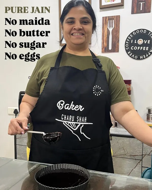 This is my promise to you, written right on my apron. I am a proud Jain home baker, and I create desserts that are pure, healthy, and made with love.