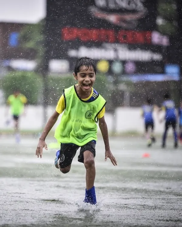 This is what pure joy looks like. We believe tough conditions build tougher kids, and our players embrace every moment, rain or shine.