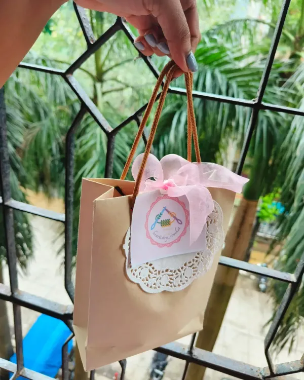 This is how I package my little crochet heart pots. The mini gift bag with a custom tag and doily makes it feel like a very special present.