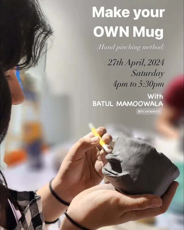 Our "Make Your Own Mug" workshop is a great place to start your pottery journey. This poster captures a moment of focus as a participant sculpts a face onto their hand-pinched mug.