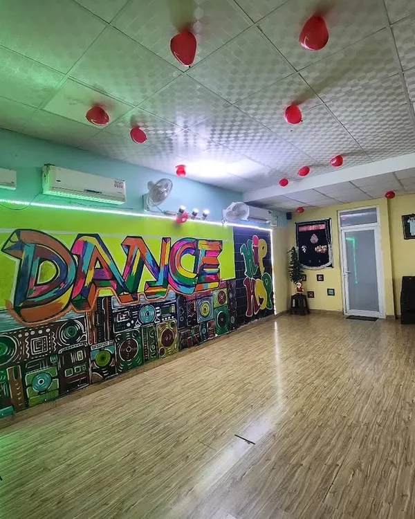 A wide view of my professional dance studio in Noida. It's a fully equipped space with mirrors and a great sound system, designed to inspire creativity and help you forget your troubles and dance.