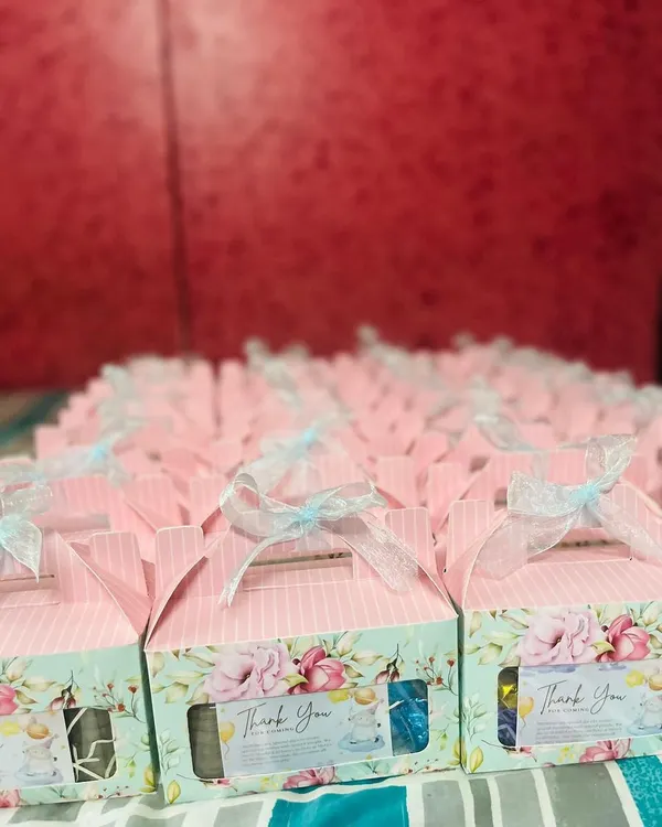Here is a large order of baby shower return favors I prepared. Each box features a lovely floral and pastel design and is tied with a delicate ribbon, ready to thank the guests.