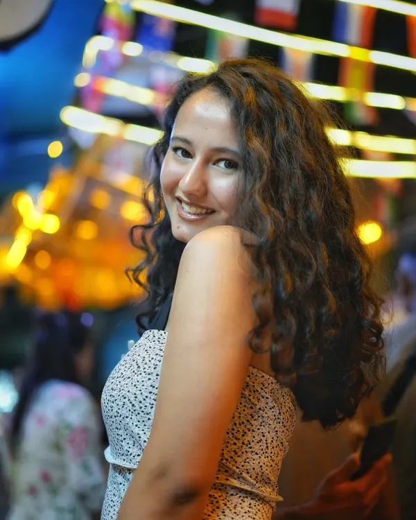 Night shoots in Delhi have their own vibe. Here on the streets of Majnu Ka Tila, I used the vibrant city lights to create this beautiful bokeh effect, making the portrait pop. It’s all about capturing that genuine smile against a lively background.