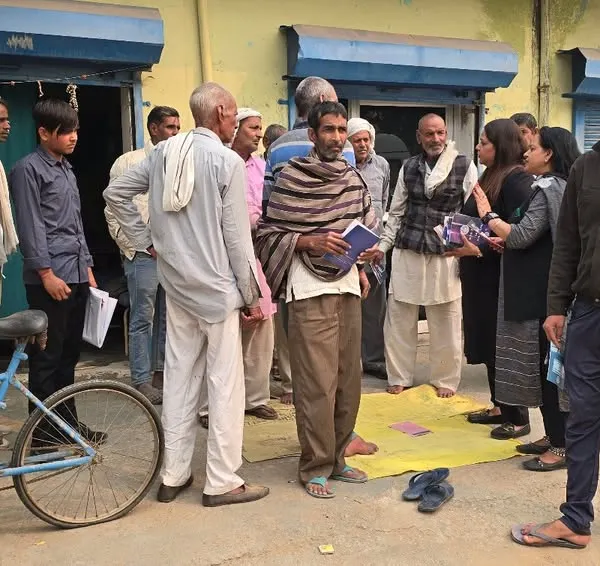 Taking legal awareness directly to the people. Here, I am interacting with residents of a village during a mobile legal aid campaign organized by DLSA, Gurugram, answering their questions and distributing informational materials.