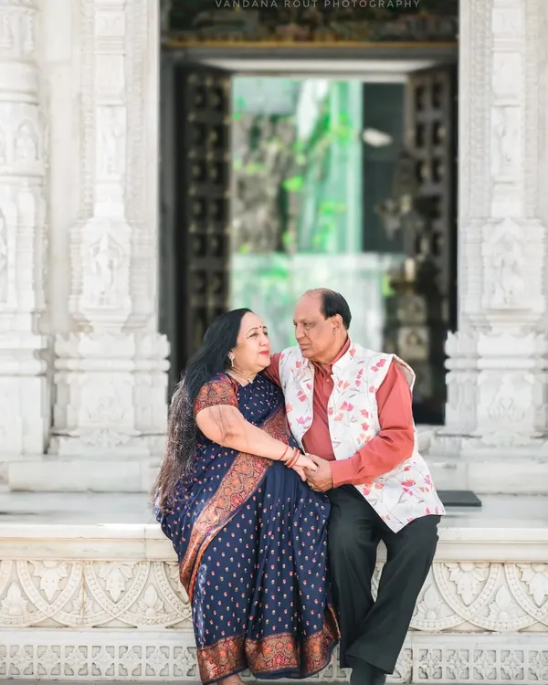 A couple celebrating their 50th anniversary, captured in a serene moment at a temple. I love creating beautiful portraits that honor a lifetime of love and companionship.