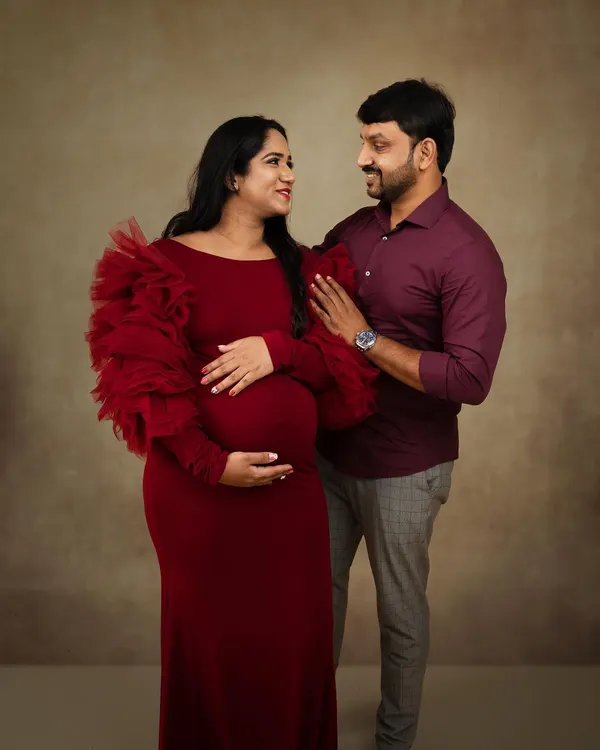 For Rakshita's maternity shoot, we started with this stunning red gown. I kept the makeup soft and romantic to highlight her natural glow, creating a beautiful memory for the parents to be.