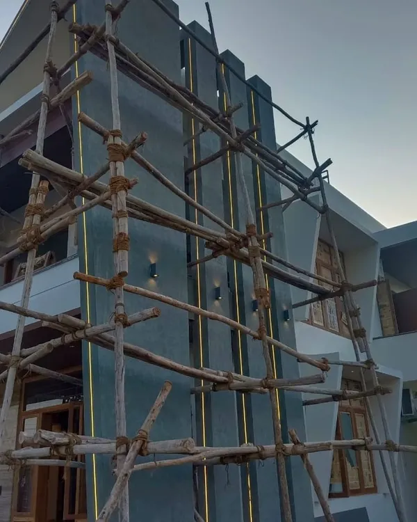 This is the most important visual for capturing attention. We are equipped to handle large-scale commercial painting projects for businesses in Namma Bengaluru. This image shows our team's work in progress on a modern building exterior, highlighting our capability for complex architectural designs.