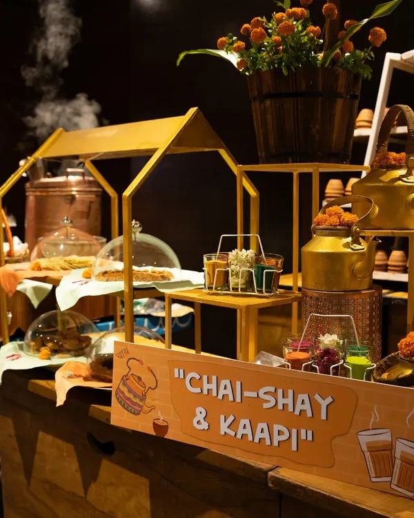Our signature 'Chai-Shay & Kaapi' station, a nostalgic and charming setup perfect for corporate high-teas. The steaming kettles and traditional snacks create a warm and inviting atmosphere for networking.