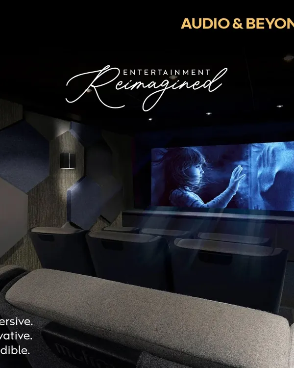 Entertainment, reimagined. This is our vision for an immersive, innovative, and incredible home cinema, featuring acoustically treated walls with hexagonal panels, comfortable tiered seating, and a perfectly calibrated screen for a truly cinematic feel.