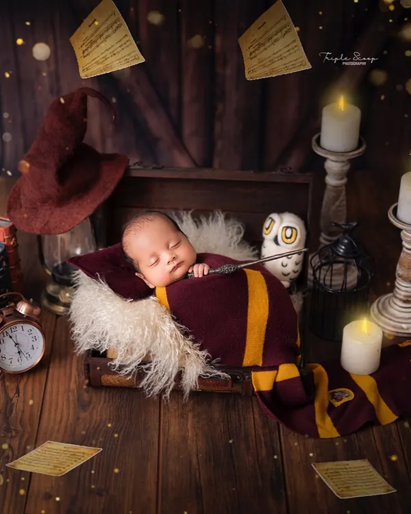 Our newest little wizard. This Harry Potter themed newborn shoot features a sorting hat, a wand, and magical floating pages to create a truly enchanting portrait for fans of the series.