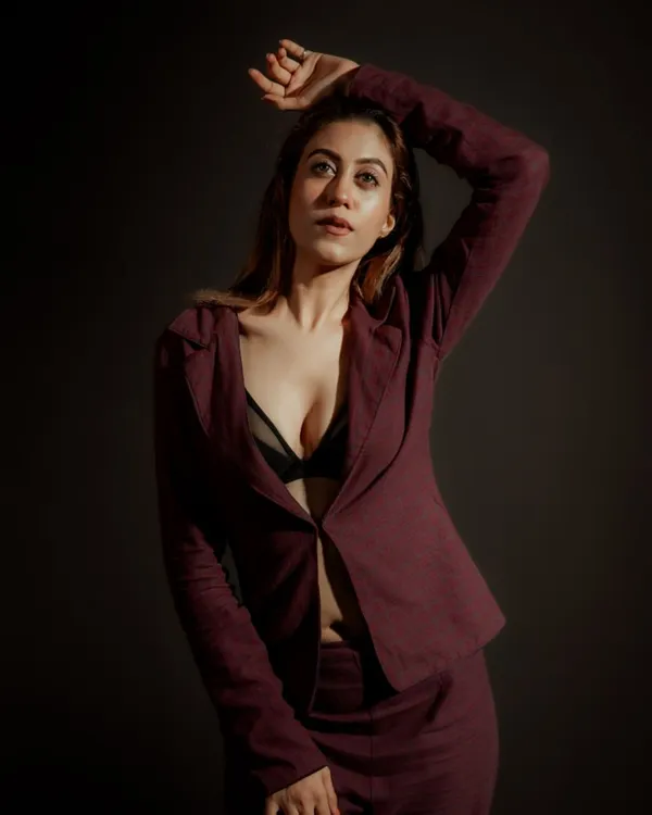 I use dramatic lighting to create powerful and confident portraits. This studio shot highlights the model's expression and the sharp tailoring of the suit, creating a high-impact image perfect for a fashion portfolio.